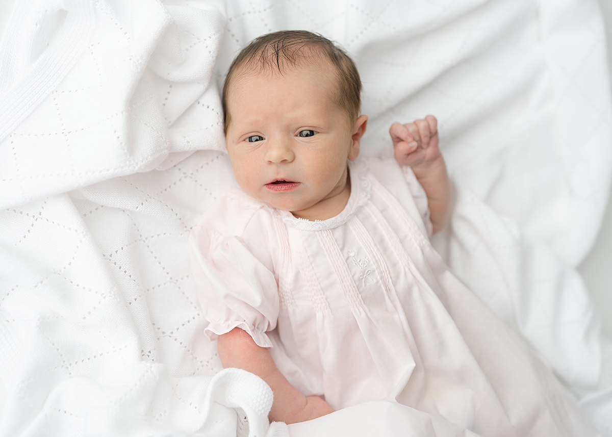 newborn baby girl photographed in a grandmillenial style dress