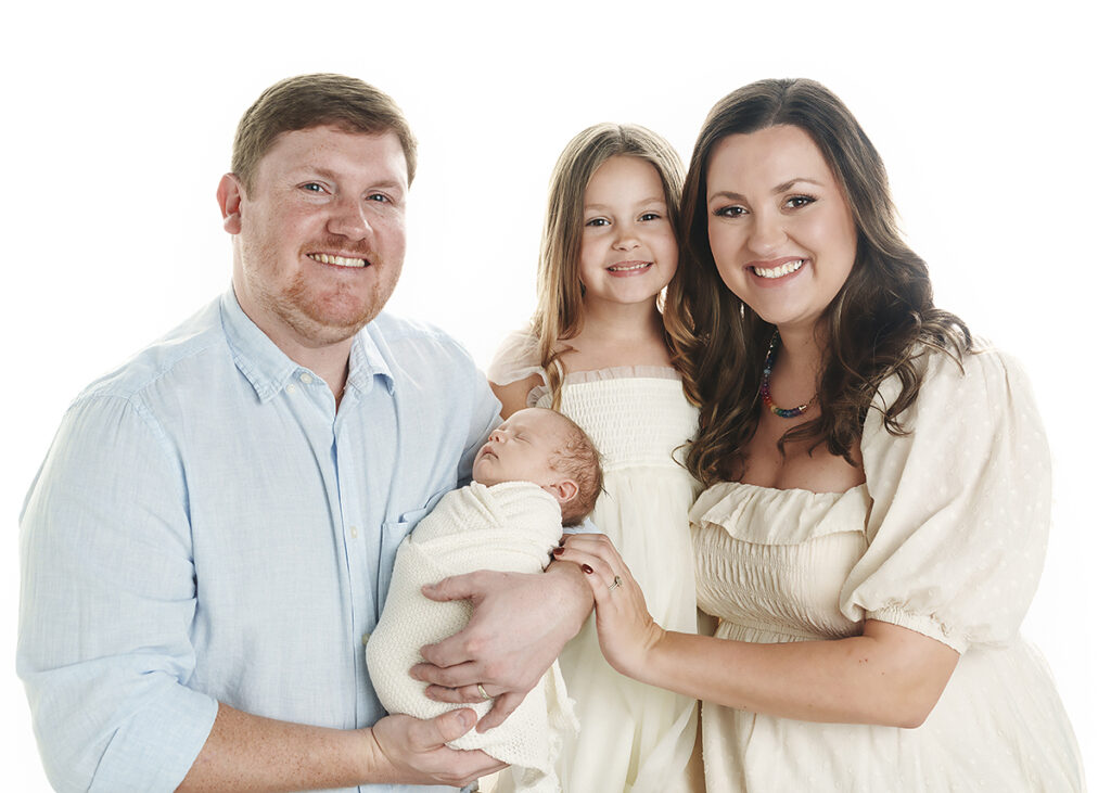 family photographed at newborn session in st simons island with big sister and new baby brother