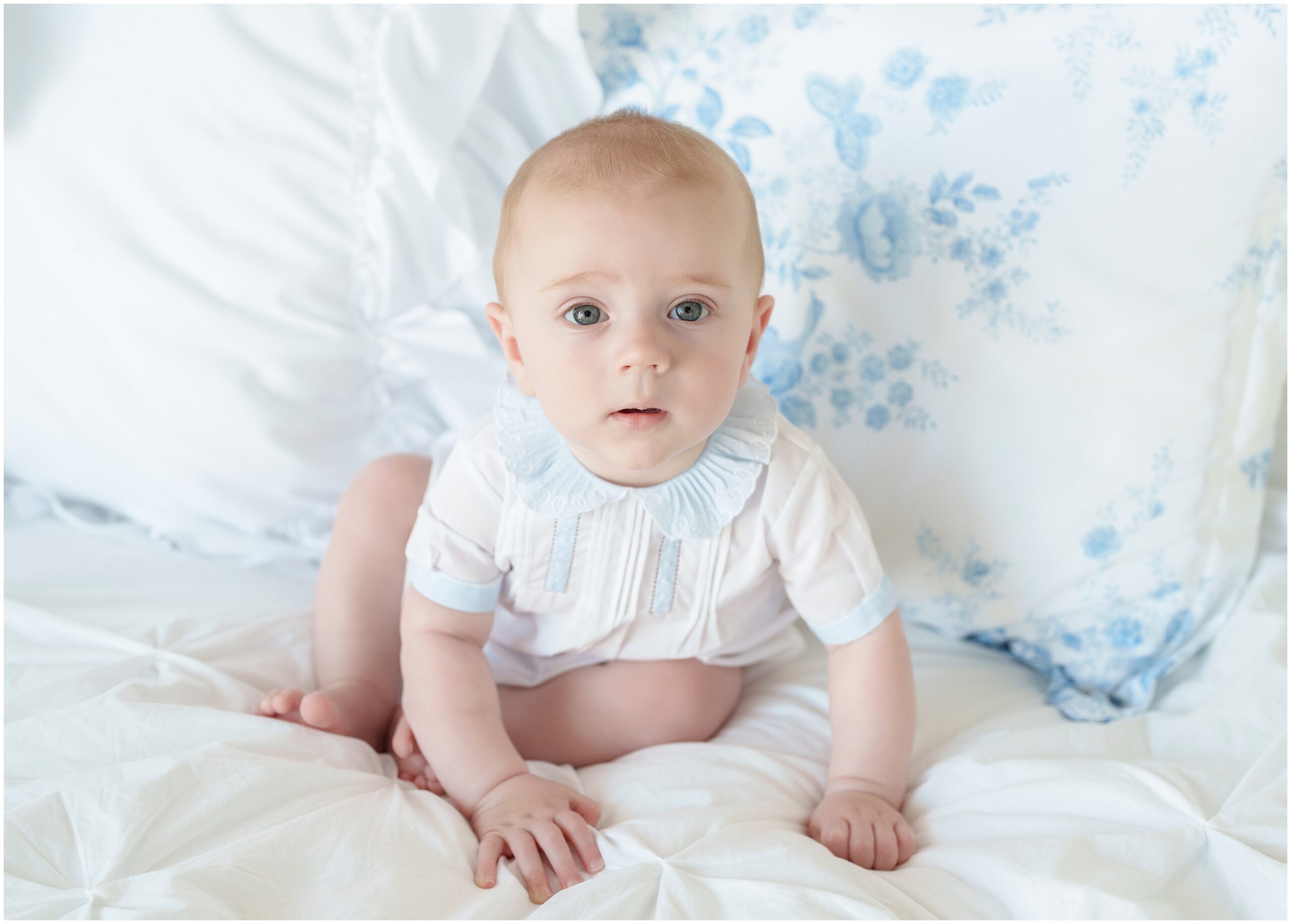 baby boy photographed in studio in a feltman brothers outfit with a grandmillenial style setup