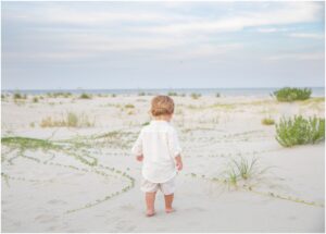 little boy photographed alone from an extended family session photographed on sea island